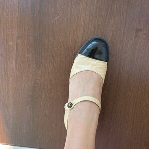 CHANEL Beige and Black Cap-Toe Mary Jane Flats